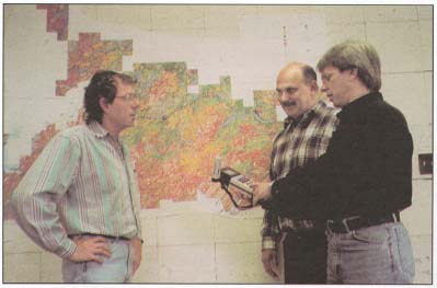 Picture of three men talking