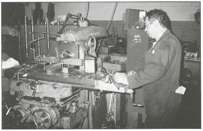 picture of a man working at a work station