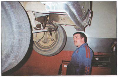 picture of a mechanic working on a car