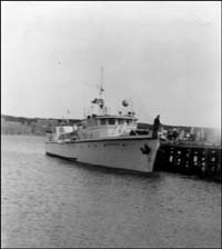 photo of a ship moored to a wharf