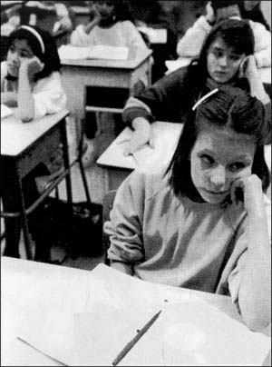 Girl looking bored in class