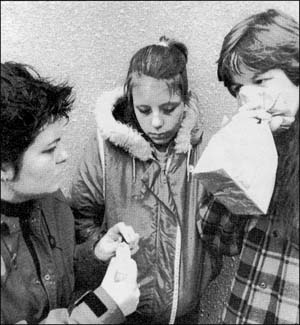 Three kids sniffing glue