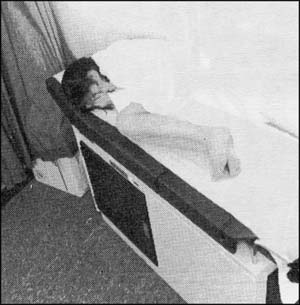 Girl culred up on examining table