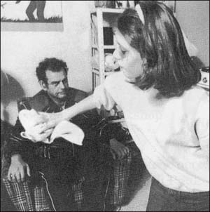 Girl throwing towel at man