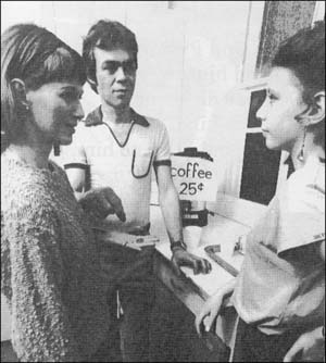 Three people standing and talking