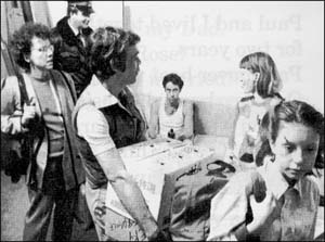 People helping a girl move out