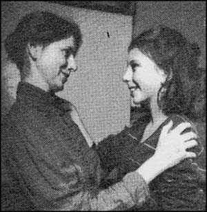 Mother hugging daughter