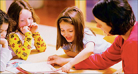 mother reading a book to her childs