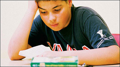 little boy reading a book