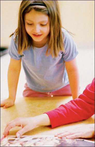 little girl reading a book