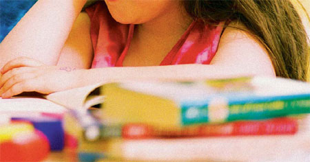 little girl reading a book