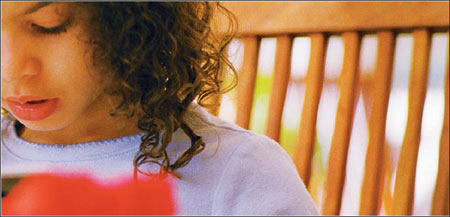 little girl reading a book