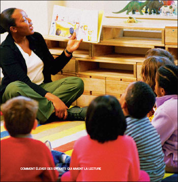 Teacher reading a book to her students