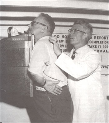 photo of a technician setting up a man for an x-ray