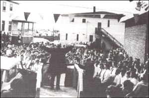 photo of J.R. Smallwood adressing a crowd of people