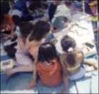 Adult and children reading