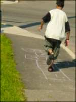 Boy playing hop-scotch