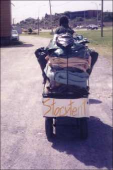 Adult with trailer containing packed Storytent items