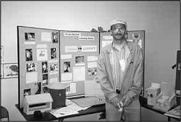 a man overseeing a work display