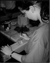 a woman doing some wood work