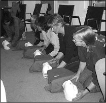 a group of women setting something up