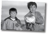 Two boys back from fisking trip