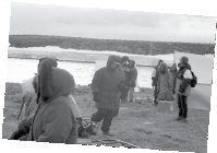 People out building a camp site