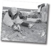 Elderly woman sewing