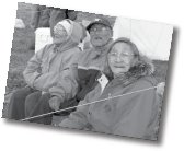 3 elder inuit sitting