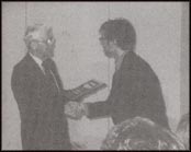 His Honor, Dr. A.M. House presenting Print Media Award to Mr. Troy  Turner of The Humber Log