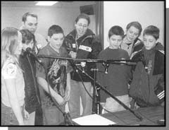 Graphic: a photograph of 5 kids and 3 staff members from the "Kids on Campus" group (left to right: Kearsey Best, Sarah Huchings, Kayla Lundrigan, Anthony Keating, Alex Whelan, Kelly Murrin, Nick Sampson, Erika Collins and Justin Hutchings)