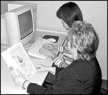 photo of a tutor and learner at a computer