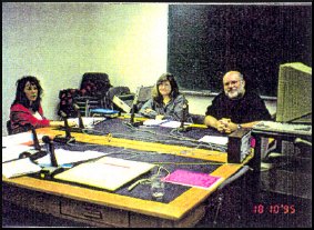 three people in a meeting