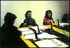 three women in a board meeting