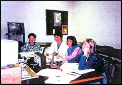 four women at a meeting