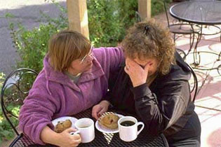 a distraught woman being consoled.