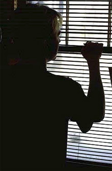 a woman looking out a window