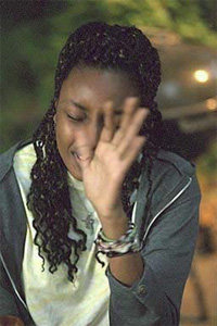 A woman blocking her face with her hand