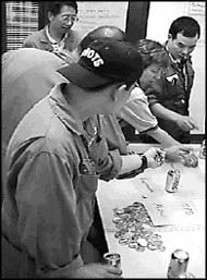 photo of people standing around a table