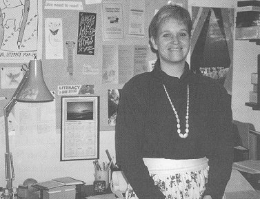 Marnie standing by her bill board