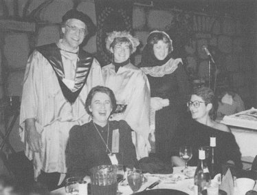 Some people are dressed up in a medieveal style