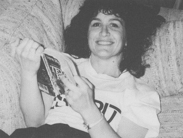 Leana on a couch and reading