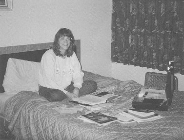 Linda sitting on a bed