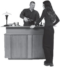 A man serving a woman at the bar.