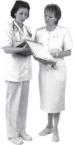 Two healthcare workers looking at a chart.