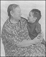 photo of an aboriginal woman holding a young child
