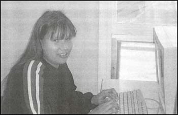 photo of a female person at a computer