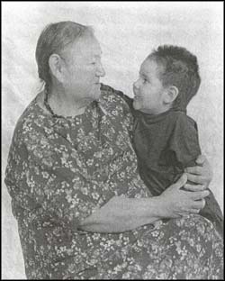 photo of an aboriginal women holding a young child