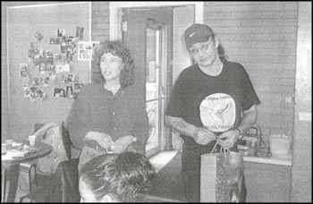 photo a two people, one mal and one female standing in a classroom