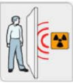 man beside a door, with radiation on the other side